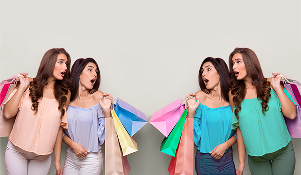 Bespoke personal photo retouching services showing four women with colourful shopping bags
